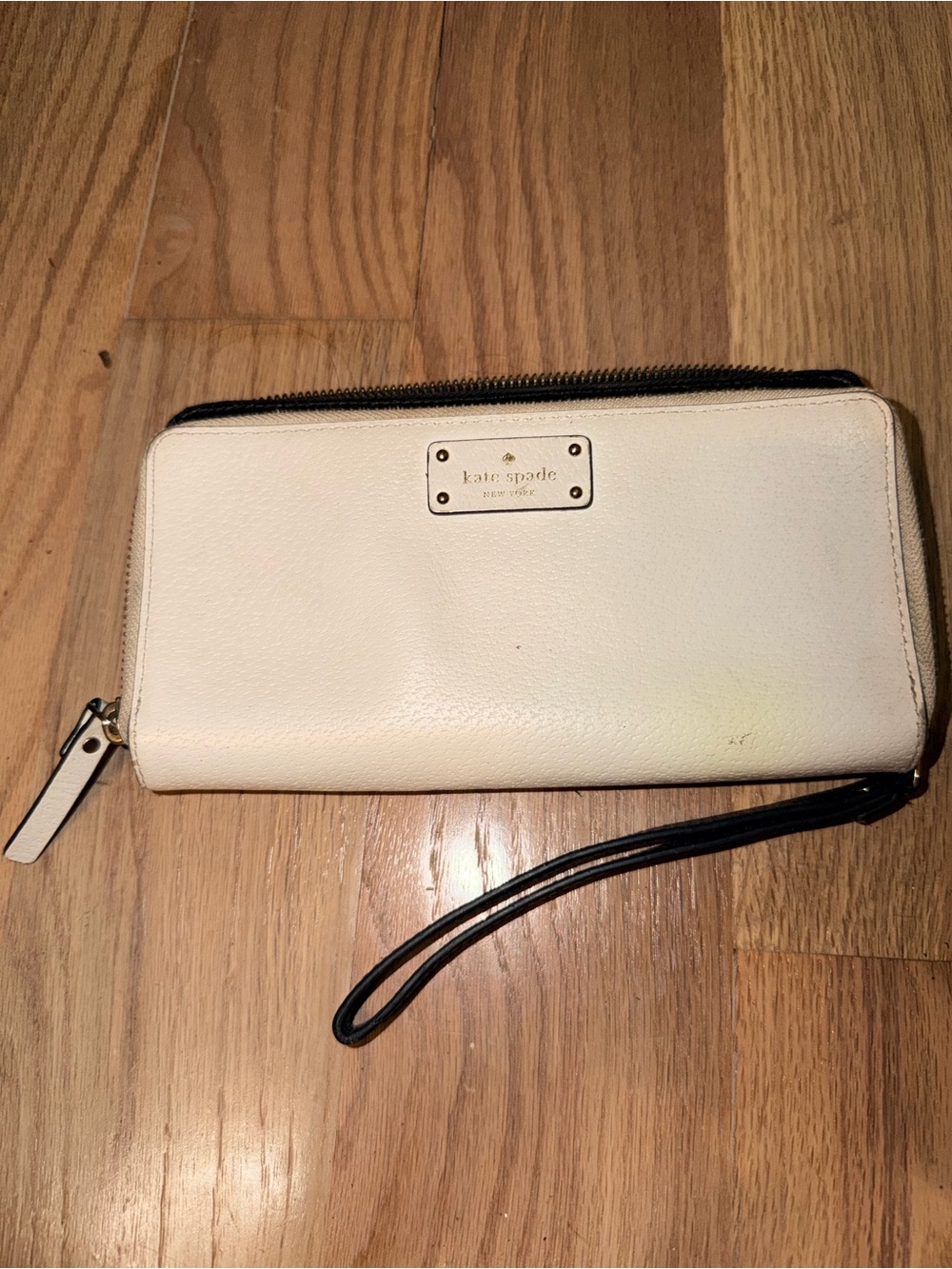 kate spade cream wristlet wallet with black strap